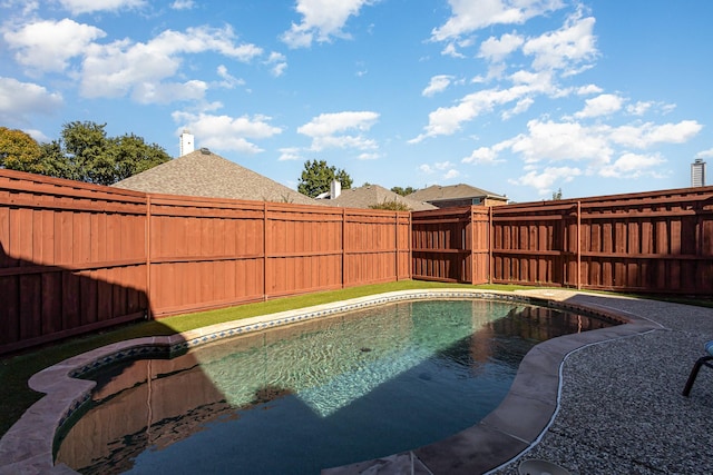 view of swimming pool with a fenced backyard and a fenced in pool