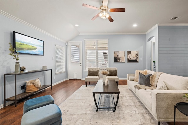 living room with hardwood / wood-style flooring, lofted ceiling, crown molding, and ceiling fan