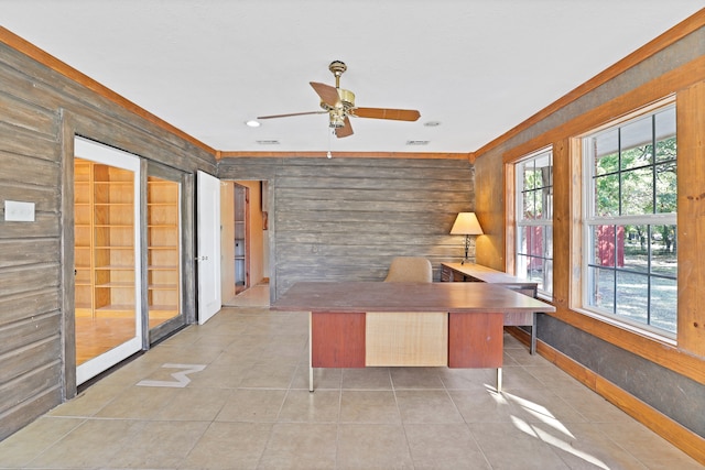 unfurnished office featuring ceiling fan and light tile patterned floors