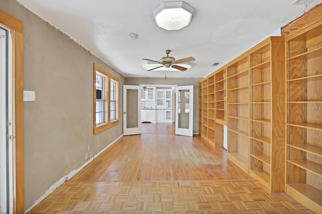 interior space with french doors and light parquet flooring