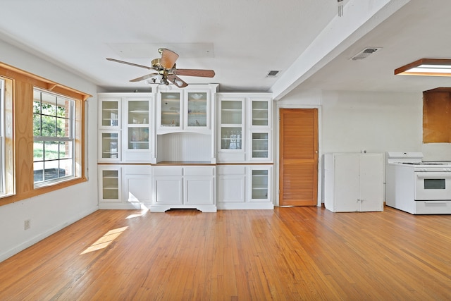 kitchen with white cabinetry, light hardwood / wood-style flooring, electric range, and ceiling fan