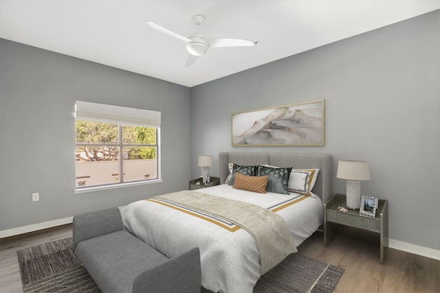 bedroom with ceiling fan and wood-type flooring