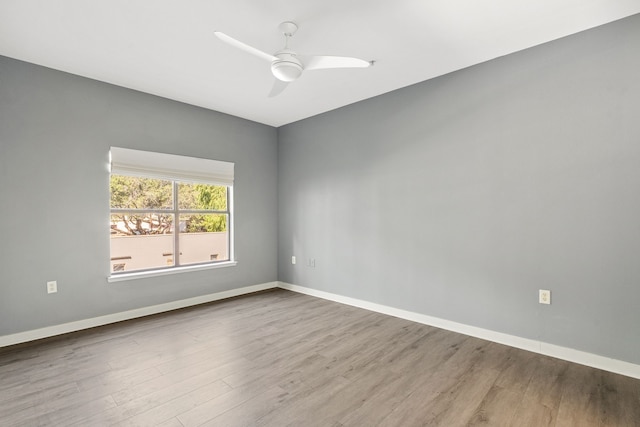 spare room featuring ceiling fan and hardwood / wood-style floors