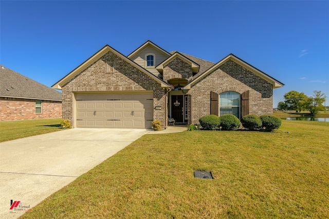 view of front of property featuring a front lawn and a garage