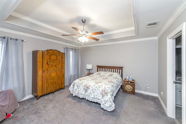 bedroom featuring ornamental molding, a raised ceiling, light carpet, and ceiling fan