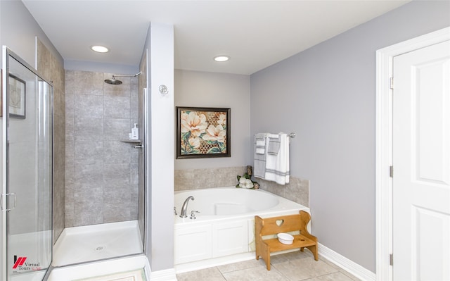 bathroom featuring separate shower and tub and tile patterned flooring