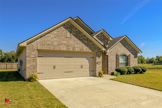 front of property featuring a front yard and a garage