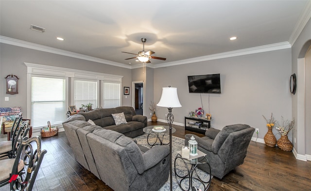 living room with crown molding, dark hardwood / wood-style floors, and ceiling fan