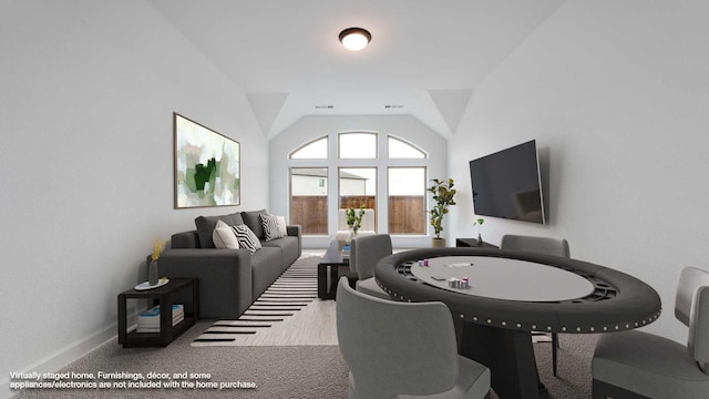 playroom featuring lofted ceiling, carpet flooring, and baseboards