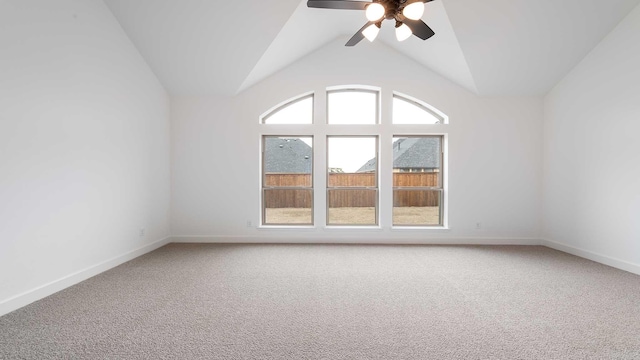 unfurnished room with light carpet, ceiling fan, lofted ceiling, and baseboards