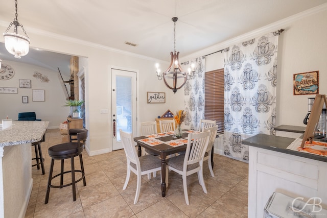 tiled dining area with crown molding and a chandelier