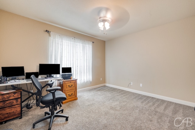 office with ceiling fan and light colored carpet