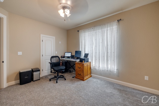 office area with carpet floors and ceiling fan