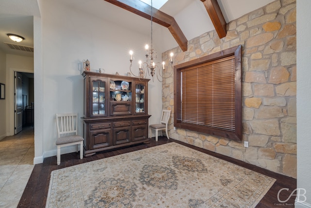 unfurnished dining area featuring dark wood-type flooring, a chandelier, and vaulted ceiling with beams