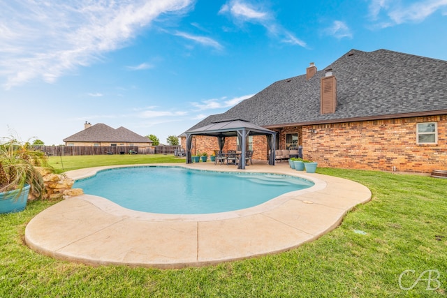 view of pool with a yard, a gazebo, and a patio