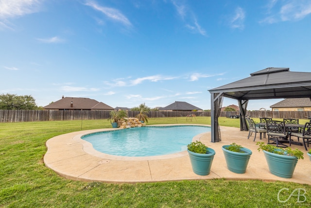 view of pool featuring a patio, a gazebo, and a lawn