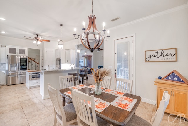 tiled dining area with crown molding and ceiling fan with notable chandelier