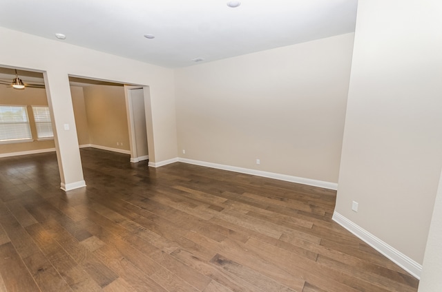 spare room featuring dark wood-type flooring