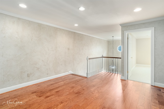 unfurnished room featuring baseboards, ornamental molding, wood finished floors, and recessed lighting