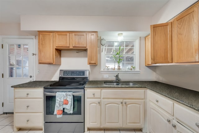 kitchen featuring light brown cabinets, stainless steel electric stove, sink, and light tile patterned floors