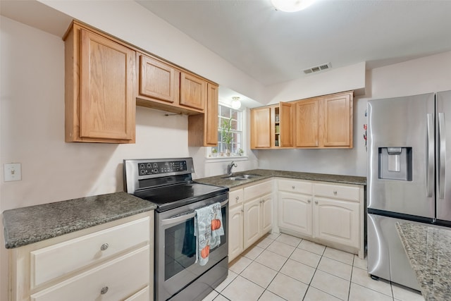 kitchen with light brown cabinets, sink, appliances with stainless steel finishes, and light tile patterned floors