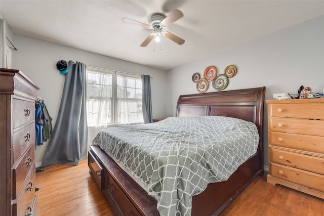 bedroom with hardwood / wood-style floors and ceiling fan