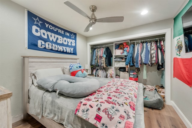 bedroom featuring a closet, hardwood / wood-style floors, and ceiling fan