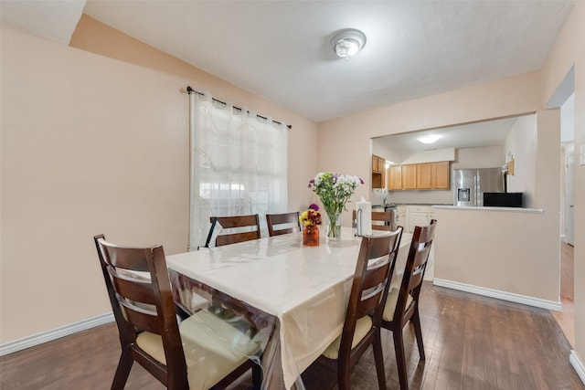 dining space featuring dark hardwood / wood-style floors