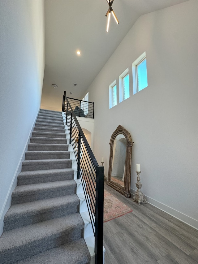 stairs featuring hardwood / wood-style floors