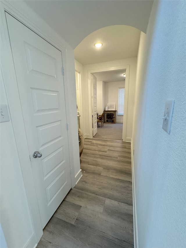 corridor with light wood-type flooring