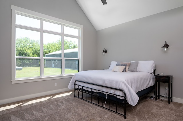 bedroom with lofted ceiling, carpet flooring, and ceiling fan