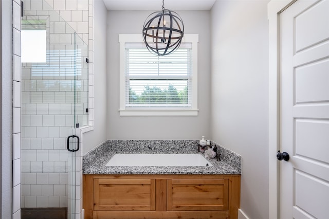 bathroom with a chandelier and plus walk in shower