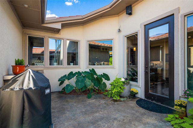 doorway to property featuring a patio