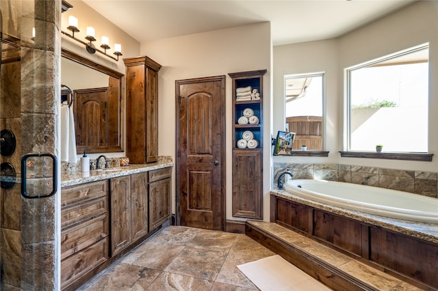 bathroom featuring vanity and a tub