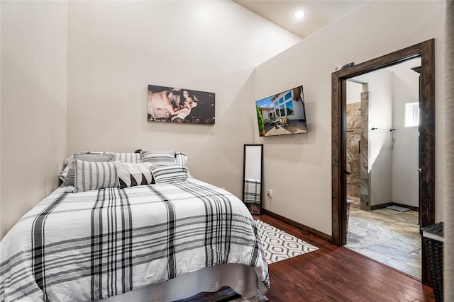 bedroom with dark hardwood / wood-style floors