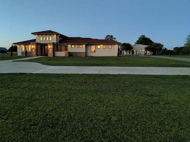 view of front of home with a lawn