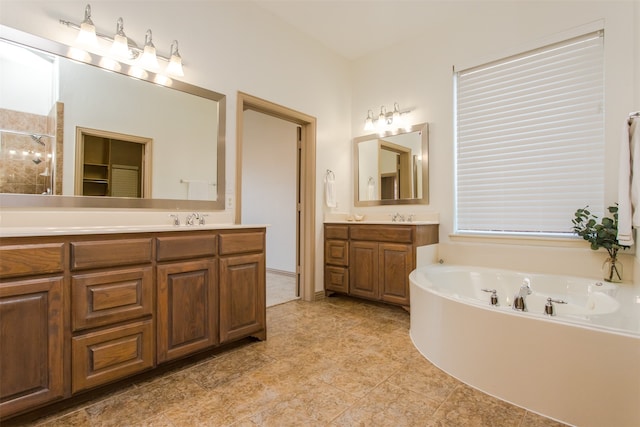 bathroom with vanity, shower with separate bathtub, and tile patterned floors