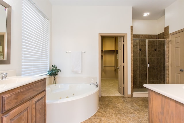 bathroom featuring vanity, tile patterned floors, and shower with separate bathtub