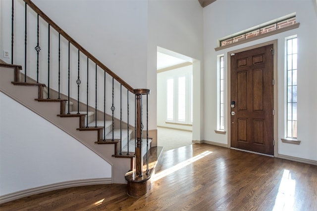 foyer entrance with hardwood / wood-style floors