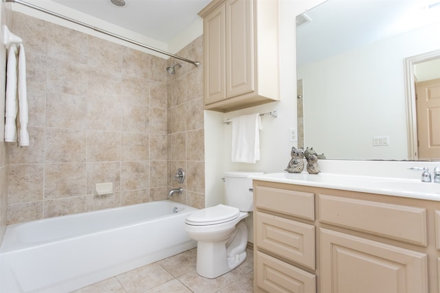 full bathroom featuring vanity, toilet, tile patterned floors, and tiled shower / bath combo