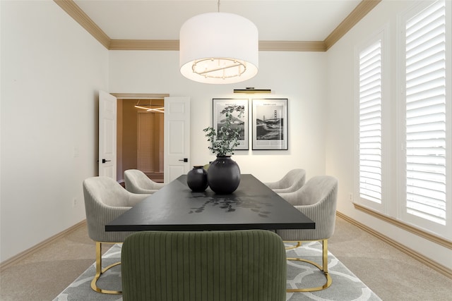 dining area featuring crown molding and light colored carpet