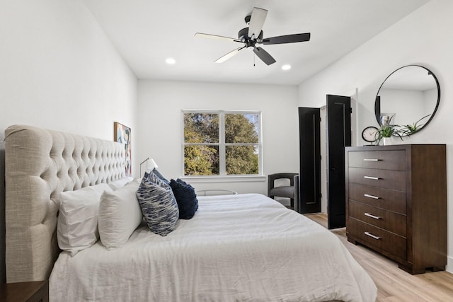 bedroom featuring ceiling fan and light hardwood / wood-style flooring