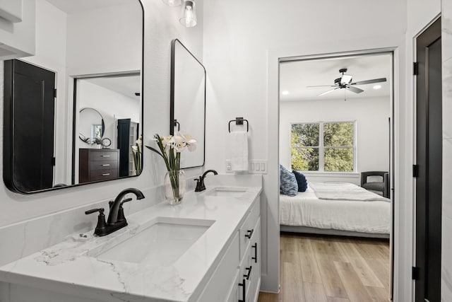 bathroom featuring vanity, hardwood / wood-style flooring, and ceiling fan