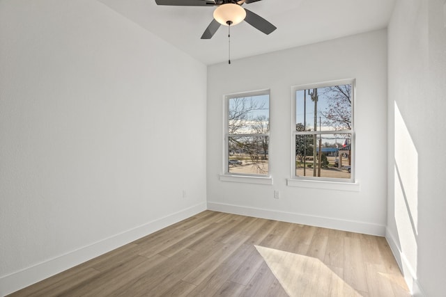 unfurnished room with ceiling fan and light wood-type flooring