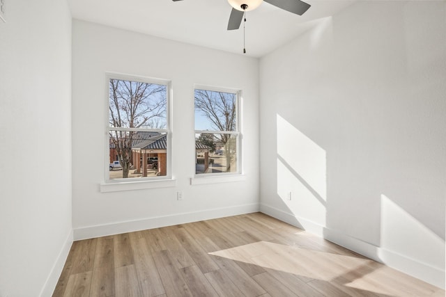 spare room with light hardwood / wood-style flooring and ceiling fan