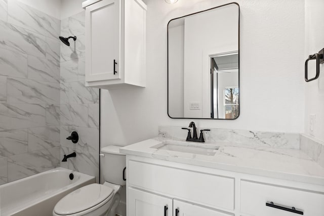 full bathroom featuring vanity, toilet, and tiled shower / bath combo