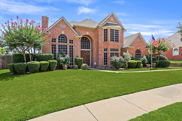 front facade with a front lawn