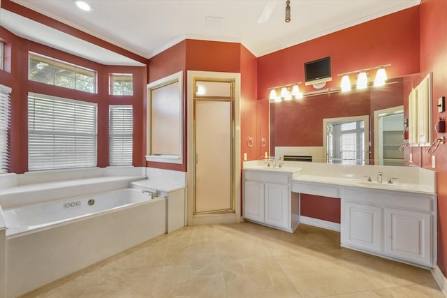 bathroom featuring a tub, vanity, crown molding, and a healthy amount of sunlight