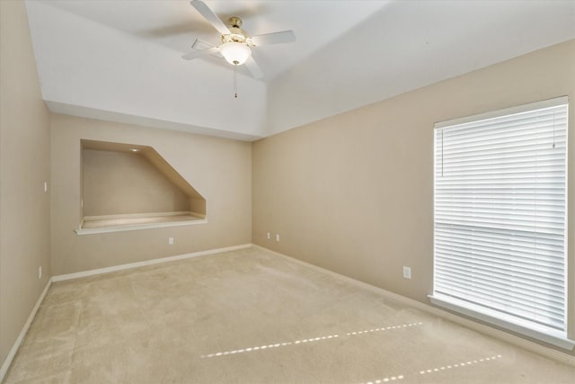 empty room with light carpet and ceiling fan