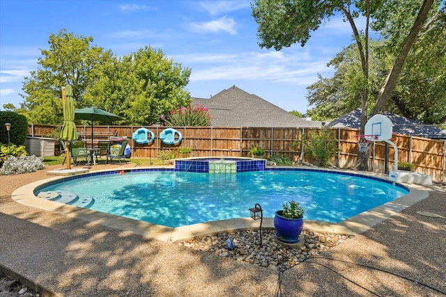 view of pool featuring an in ground hot tub